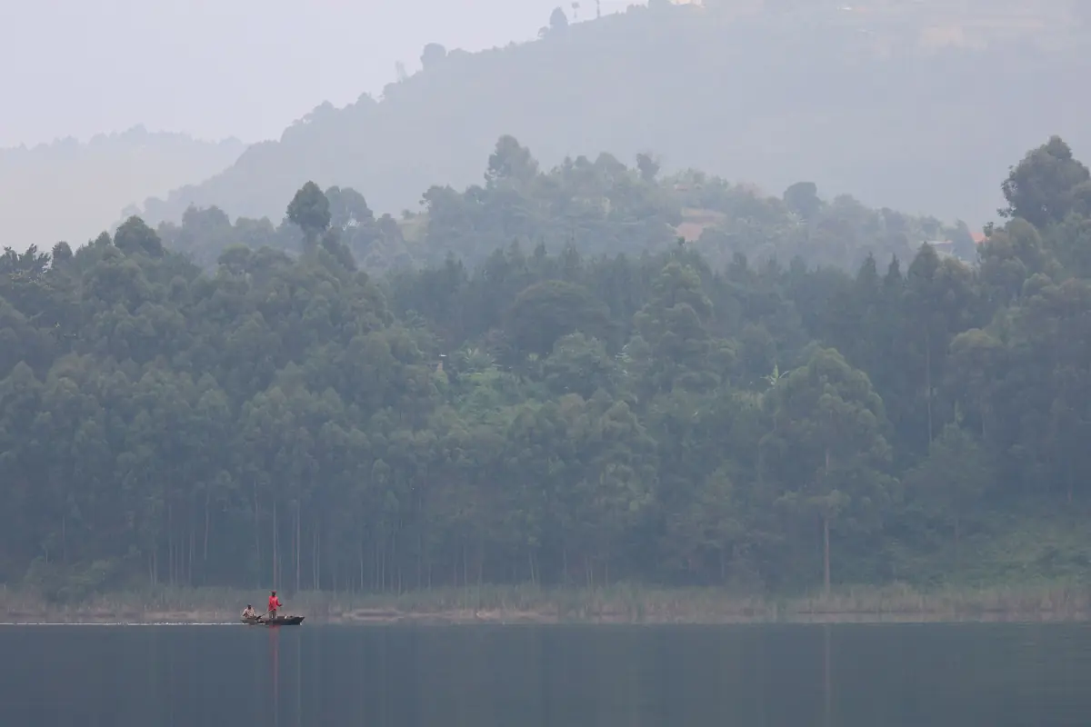 Misty forested hills along the calm water of Lake Bunyonyi